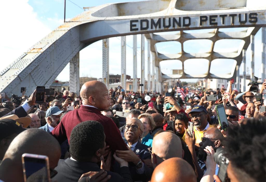 Democratic Representative John Lewis of Georgia speaks to the crowd at the Edmund Pettus Bridge