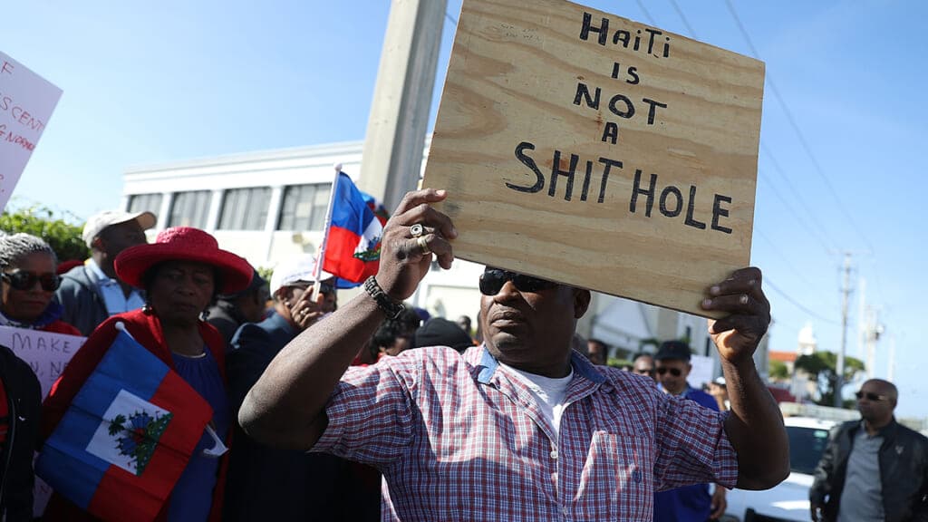 People protest near the Mar-a-Lago resort