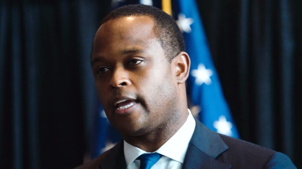 Kentucky Attorney General Daniel Cameron wearing a navy suit and blue tie