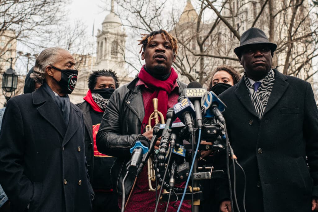 Jazz musician Keyon Harrold speaks at a press conference