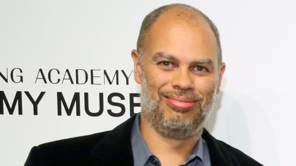 Producer Jesse Collins wearing a black jacket and gray shirt