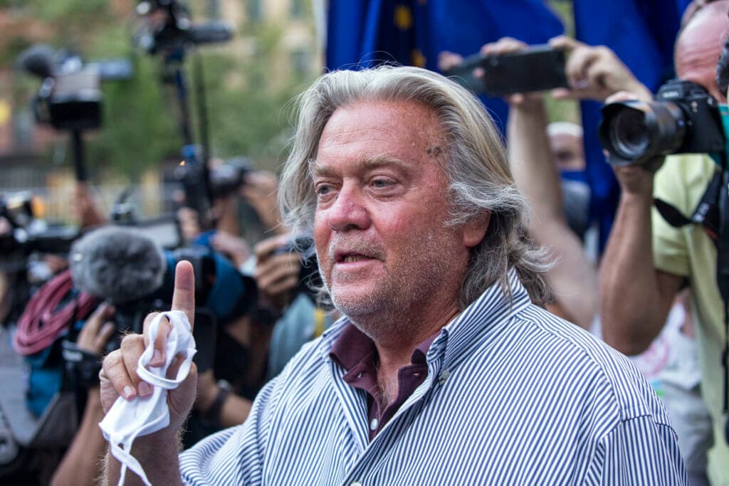 Steve Bannon, former chief strategist for former President Donald Trump, wearing a blue-striped shirt