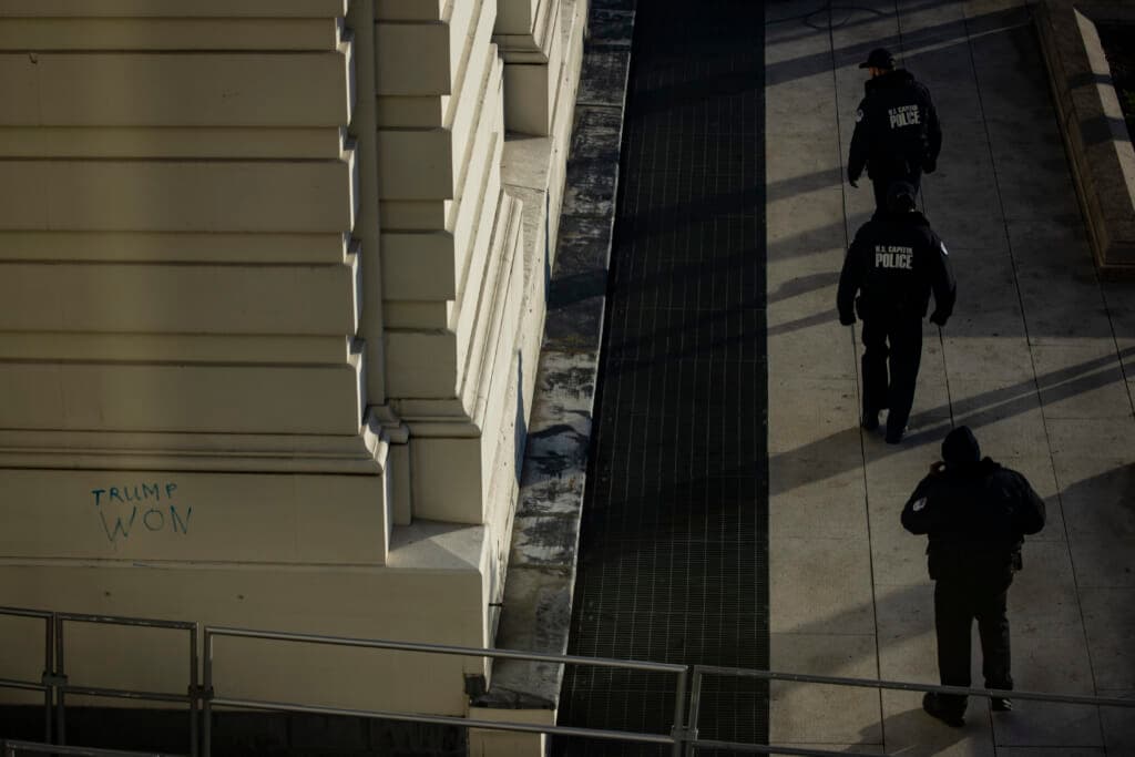 Capitol Police officers sweep the grounds of the U.S. Capitol building on January 7, 2021