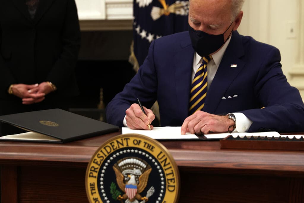 President Joe Biden signs an executive order
