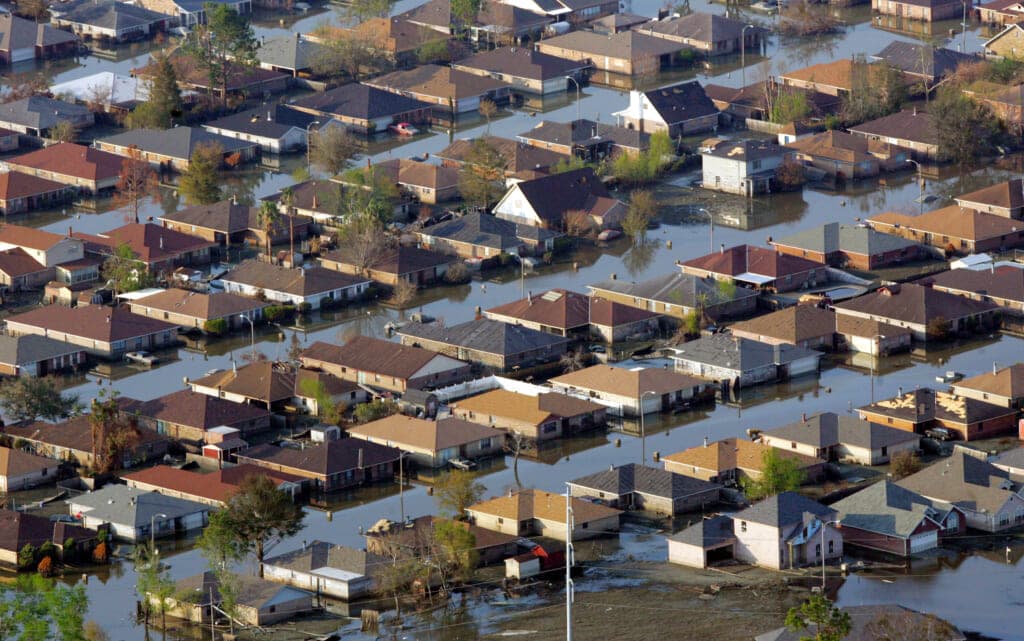 Neighborhoods are flooded with oil and water two weeks after a hurricane