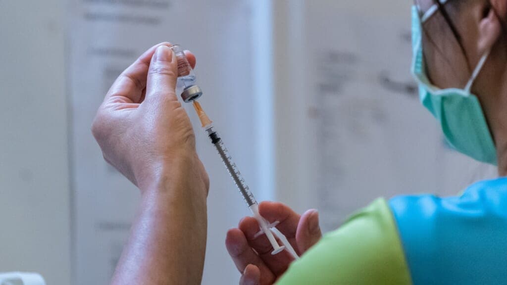 A syringe is prepared with a vaccine