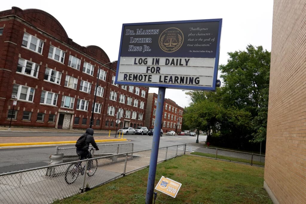 A sign in front of King Elementary School encourages students to participate in remote learning