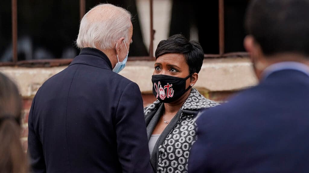 President Joe Biden talks with Atlanta Mayor Keisha Lance Bottoms