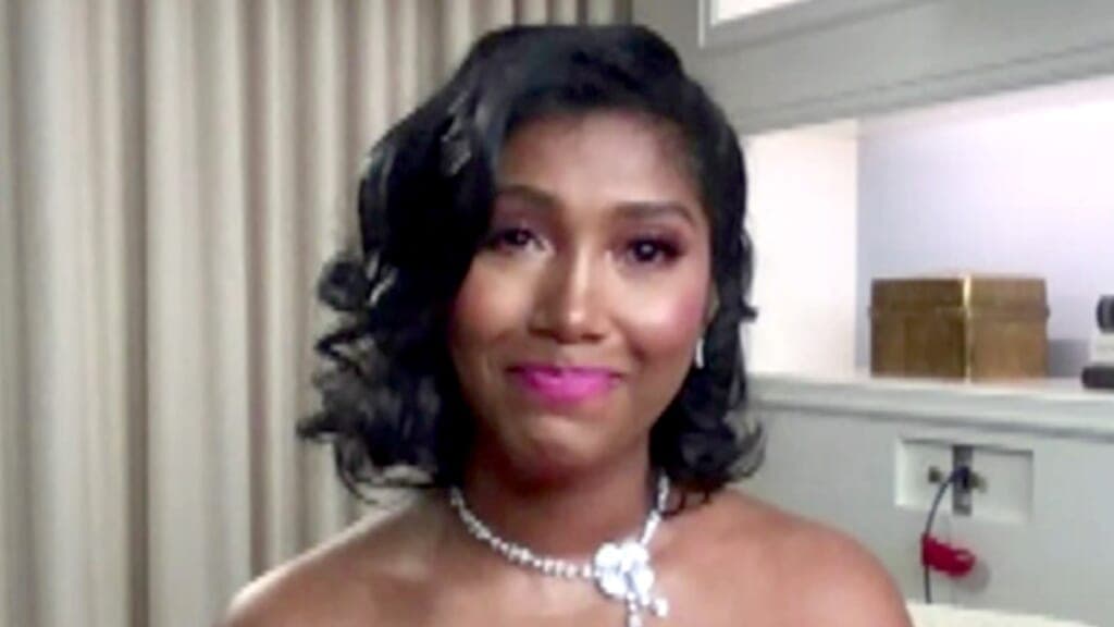 Taylor Simone Ledward Boseman, widow of late actor Chadwick Boseman, wears a white flower necklace