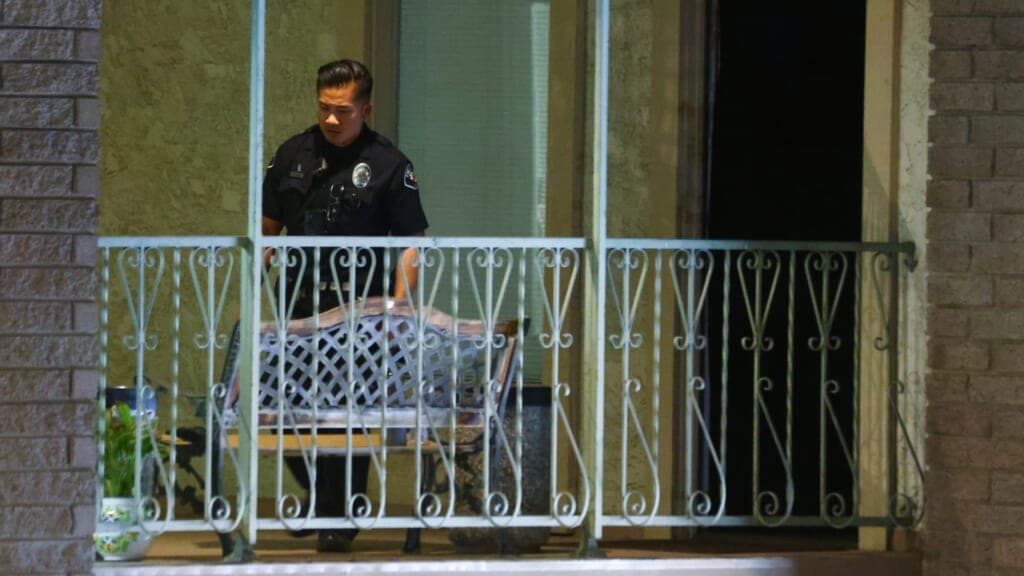A police officer keeps watch at an office building