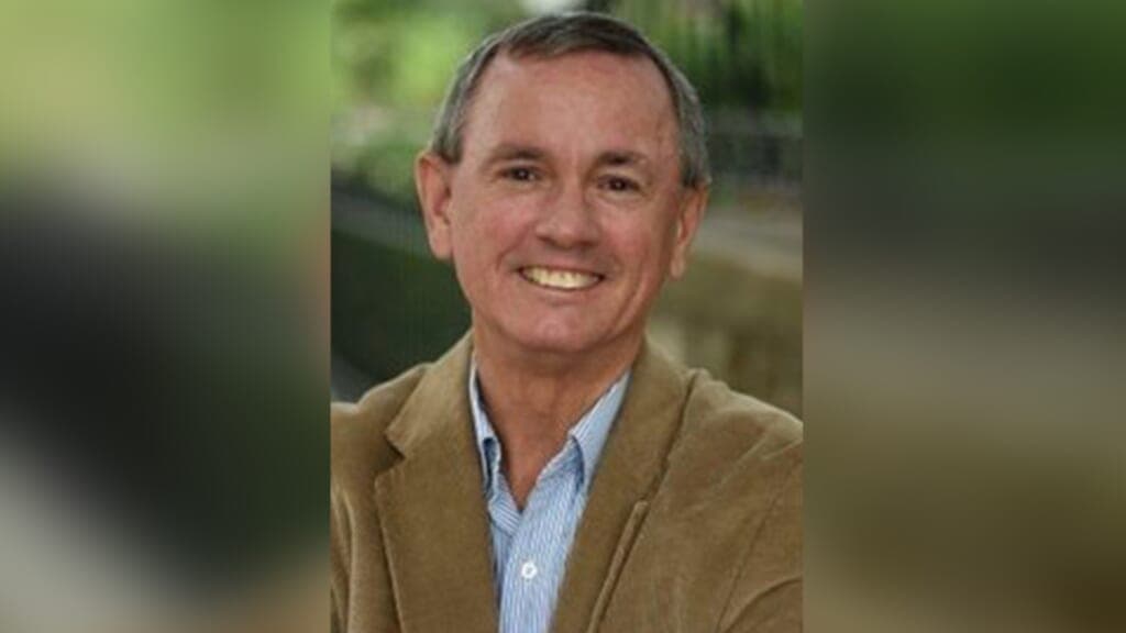 Missouri Representative Rick Roeber wearing a brown jacket and blue striped shirt