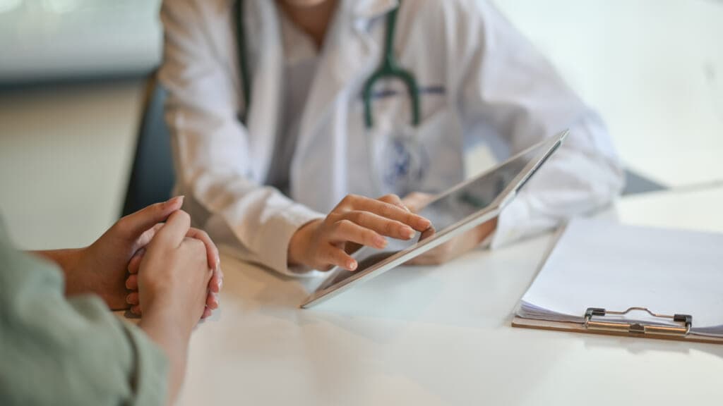 White doctor with Black patient