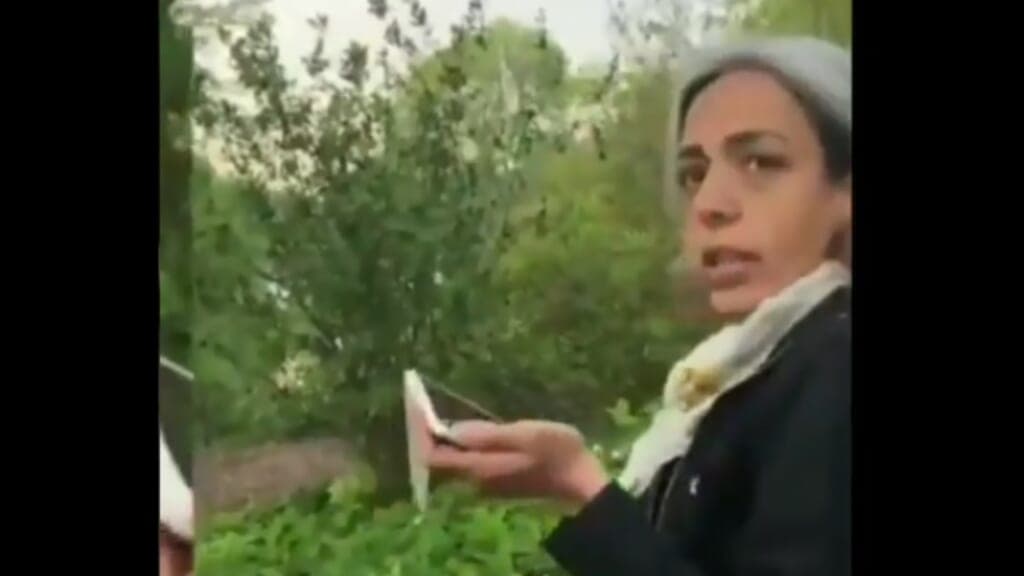 A woman holding a cell phone