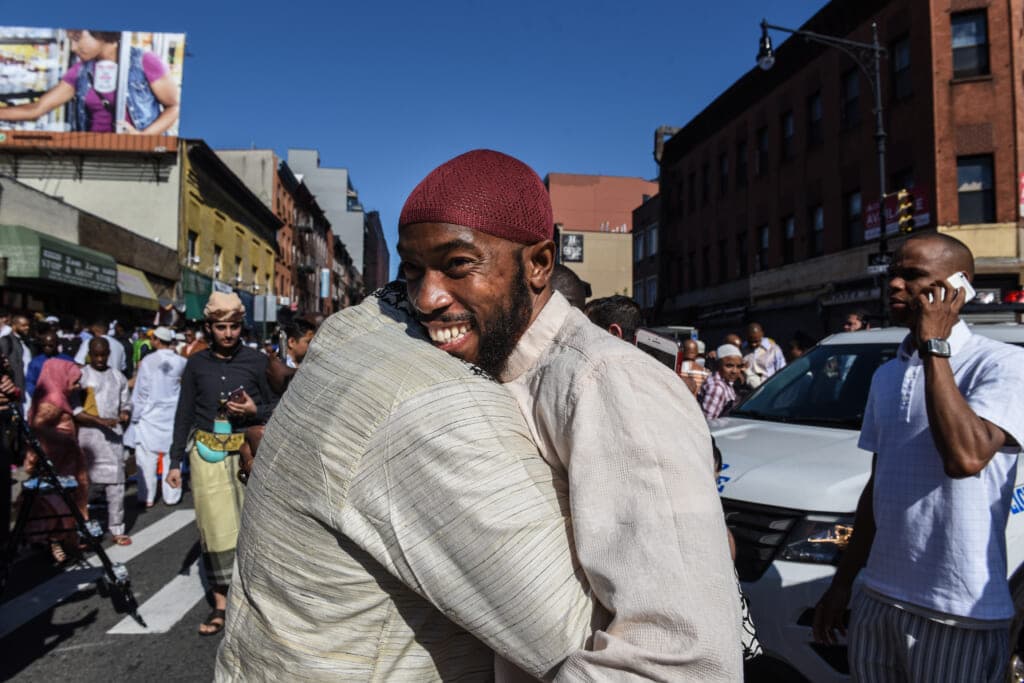 People celebrate at a mosque called the Masjid at-Taqwa after the Eid al-Fitr prayer