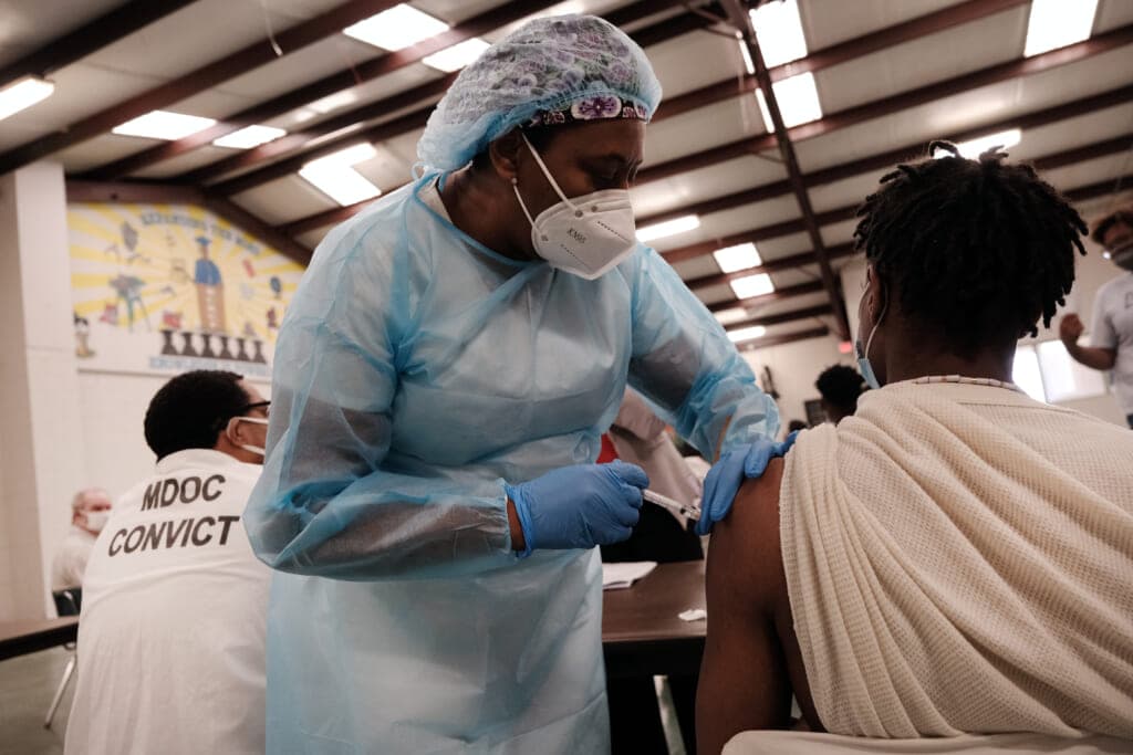 A prisoner at the Bolivar County Correctional Facility receives a COVID-19 vaccination