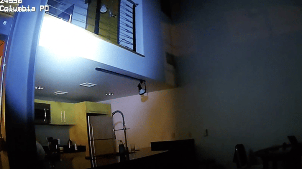 Columbia police in South Carolina enter the apartment of artist John Sims with guns drawn.