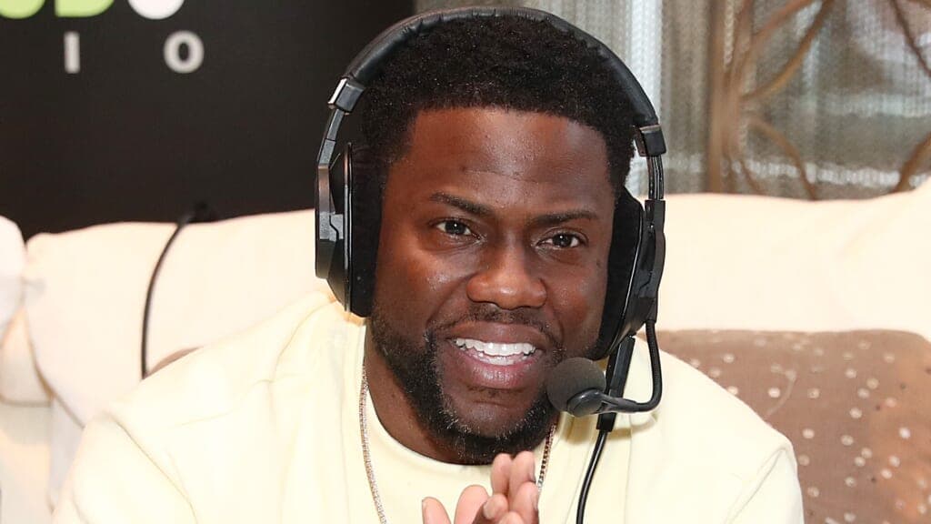Comedian and actor Kevin Hart wearing headphones