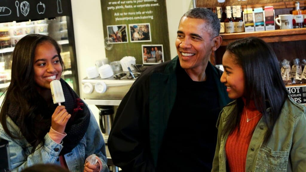 Former President Barack Obama buying ice cream for First Daughters Malia and Sasha Obama