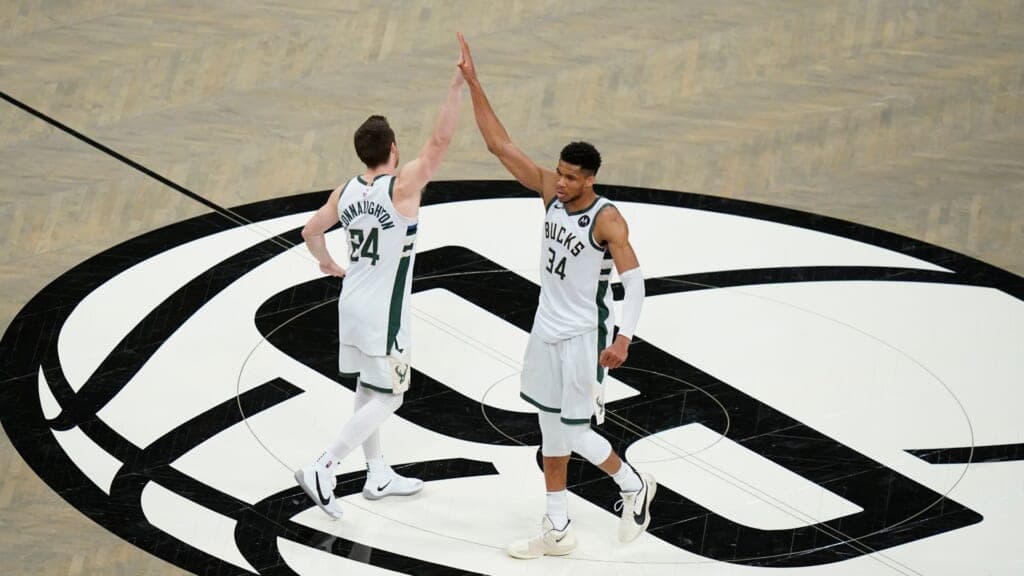 Giannis Antetokounmpo celebrates with Pat Connaughton