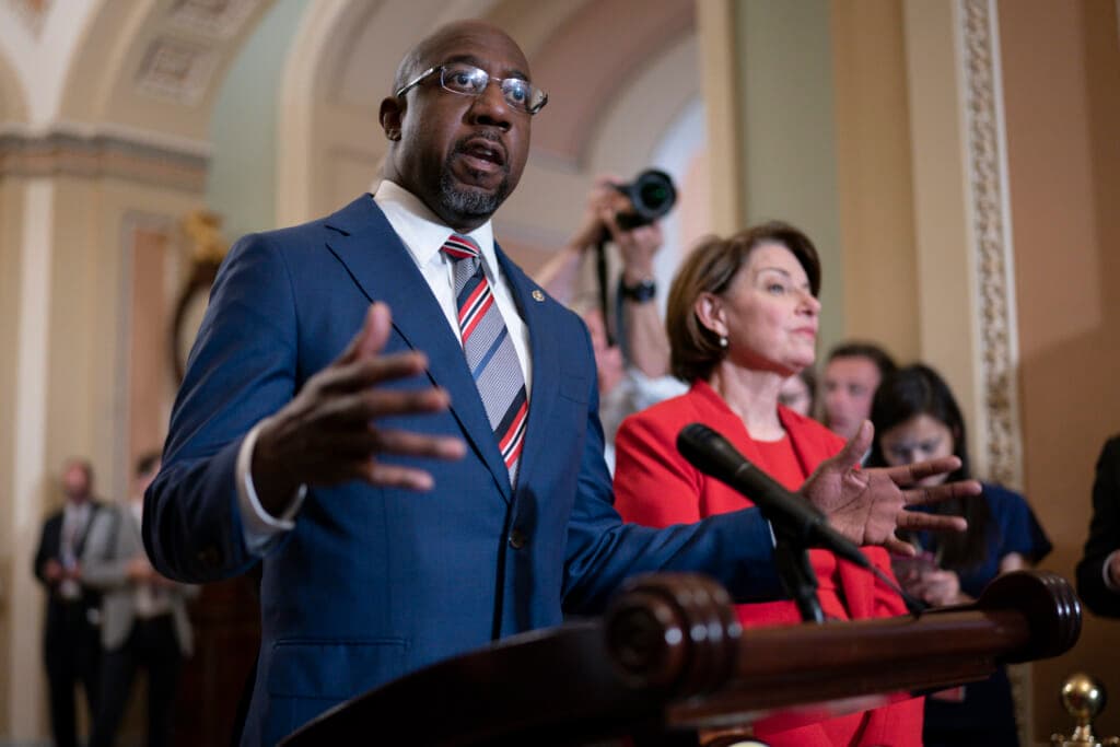 Democratic Senator Raphael Warnock of Georgia and Democratic Senator Amy Klobuchar of Minnesota