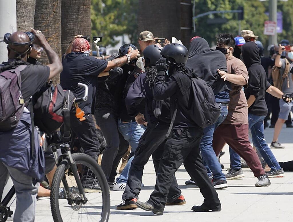 Anti-vaccination demonstrators clash with counter-protesters