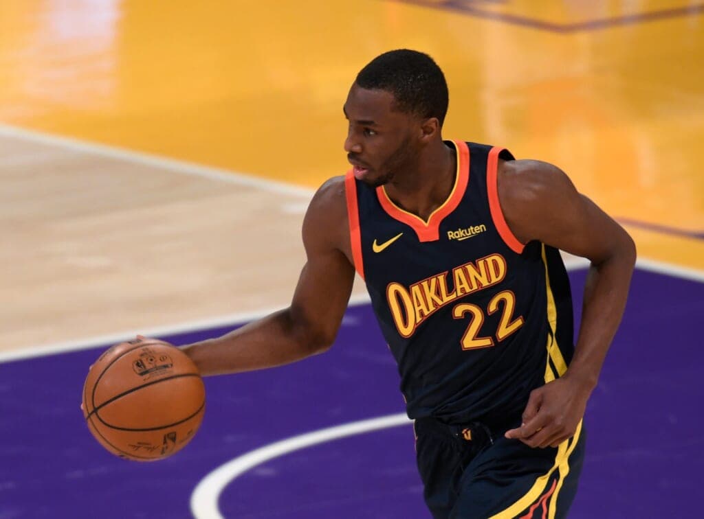 NBA player Andrew Wiggins of the Golden State Warriors on the court with a basketball in his hand