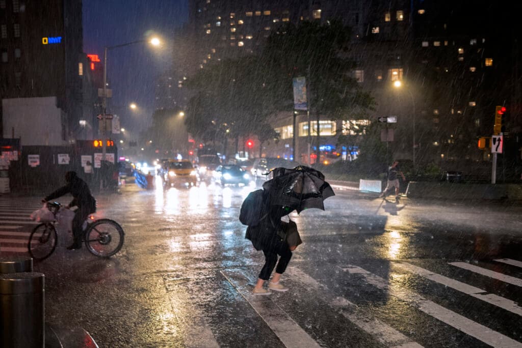 Pedestrians take cover near Columbus Circle in New York