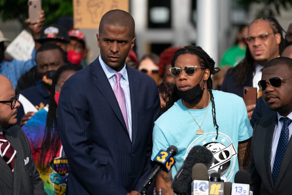 Bakari Sellers with Khalil Ferebee (C), the son of Andrew Brown Jr.