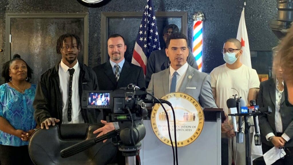 Jeffrey Thornton, second from left, and President of the People’s Association of Justice Advocates Rev. Shane Harris