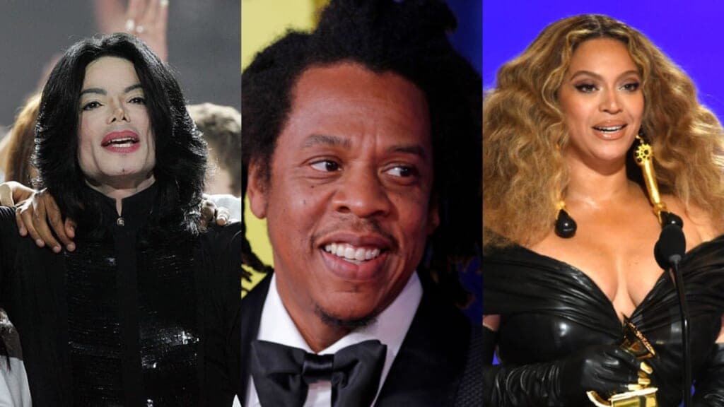 Singer Michael Jackson, wearing a black shirt, rapper Jay-Z and Beyonce wearing a black leather dress