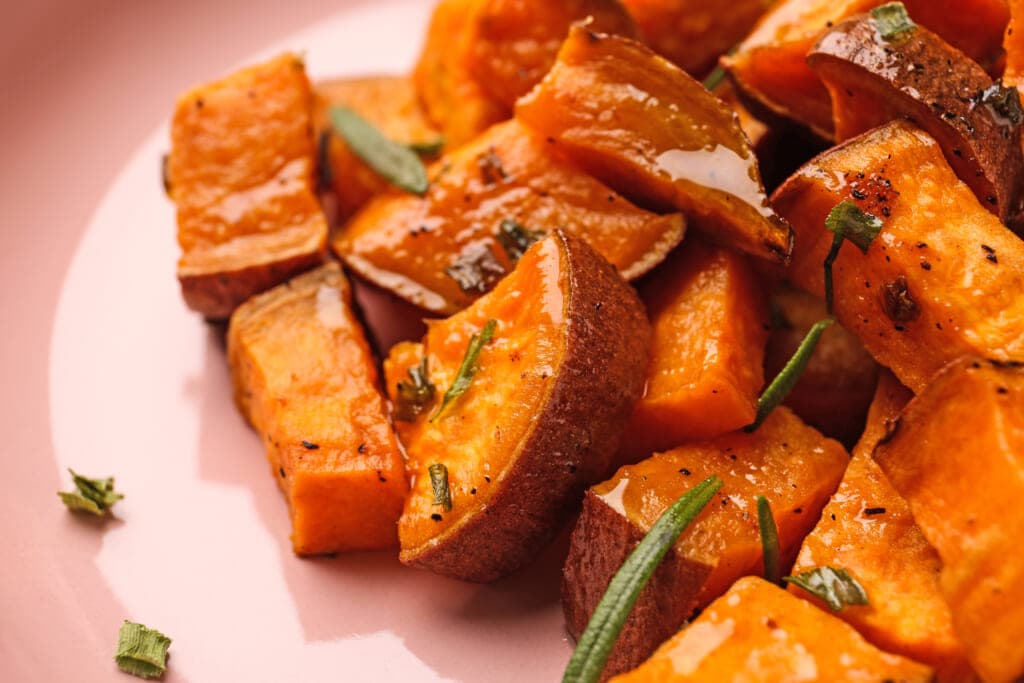 Tasty cooked sweet potato on plate