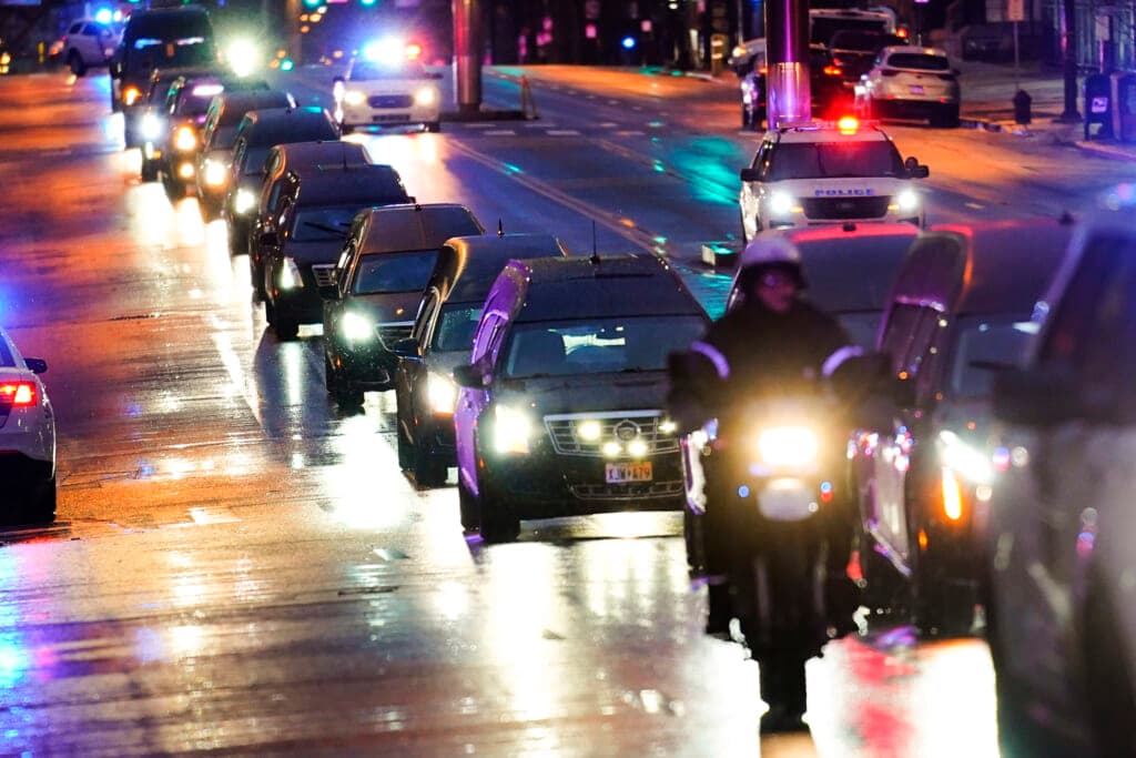 The funeral procession for the victims of a deadly row house fire