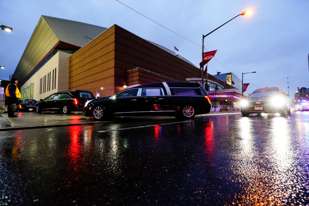 The funeral procession for the victims of a deadly row house fire