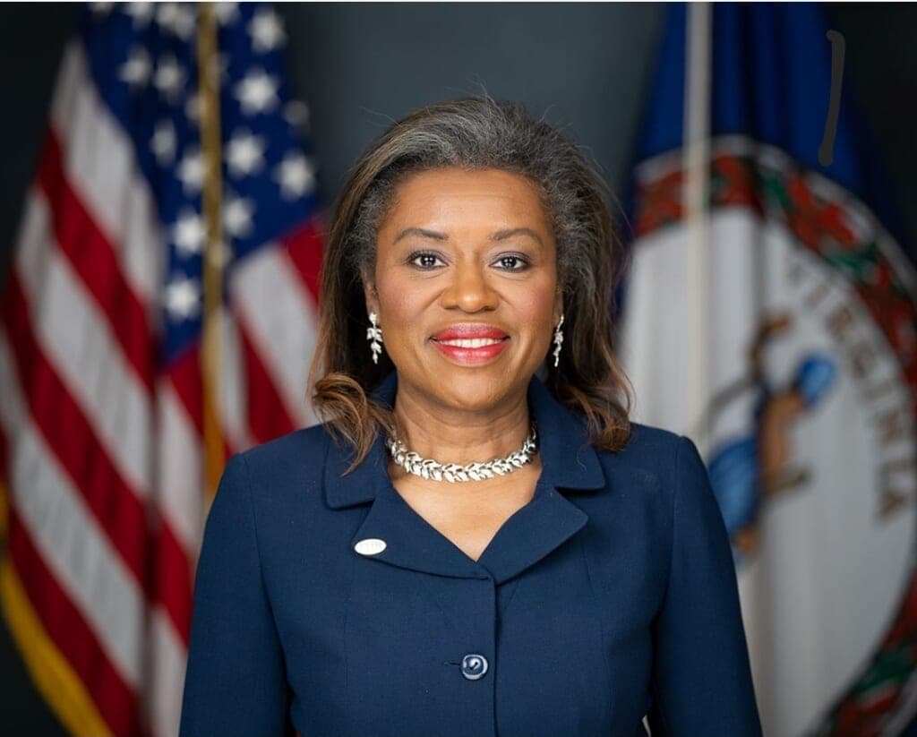 Republican Lieutenant Governor Winsome Sears of Virginia stands wearing a blue dress and silver jewelry
