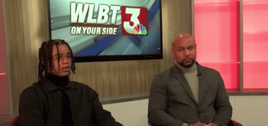 Demonterrio Gibson and his attorney, Carlos Moore, in a television station