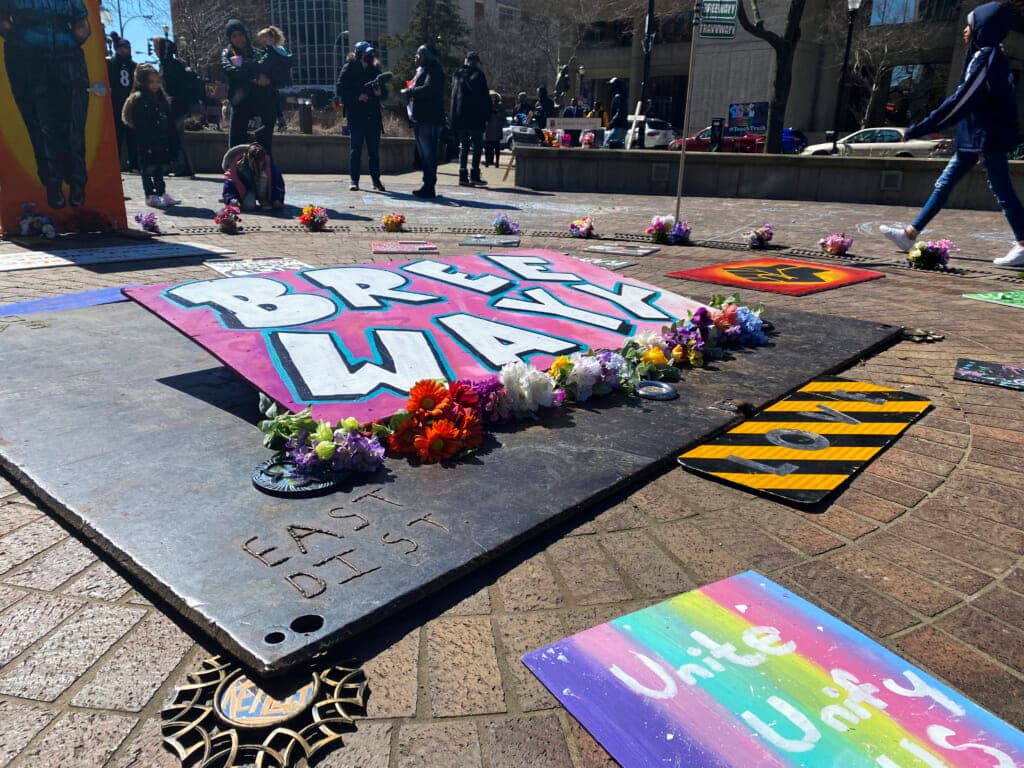 Signs and paintings in the center of Jefferson Square Park in Louisville, Kentucky