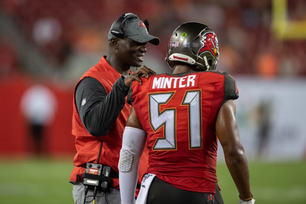 Tampa Bay Buccaneers defensive coordinator Todd Bowles speaks to Tampa Bay Buccaneers inside linebacker Kevin Minter