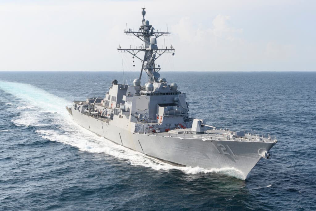 Navy guided-missile destroyer Frank E. Petersen Jr. navigates the blue waters of the Gulf of Mexico