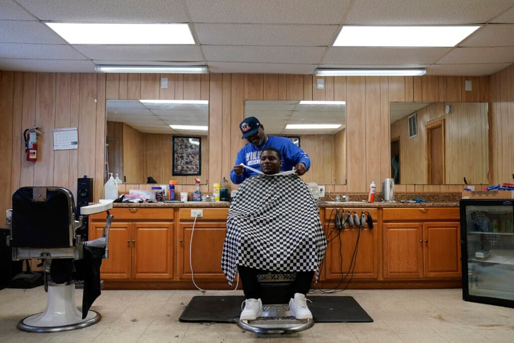 William Johnson cuts hair at Bridgers Barber Shop in Princeville, N.C.