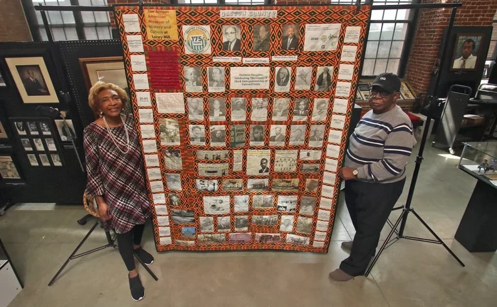 Dot Guthrie and Charles Whitesides with the Gaston County Business Pioneers Quilt in Gastonia, North Carolina