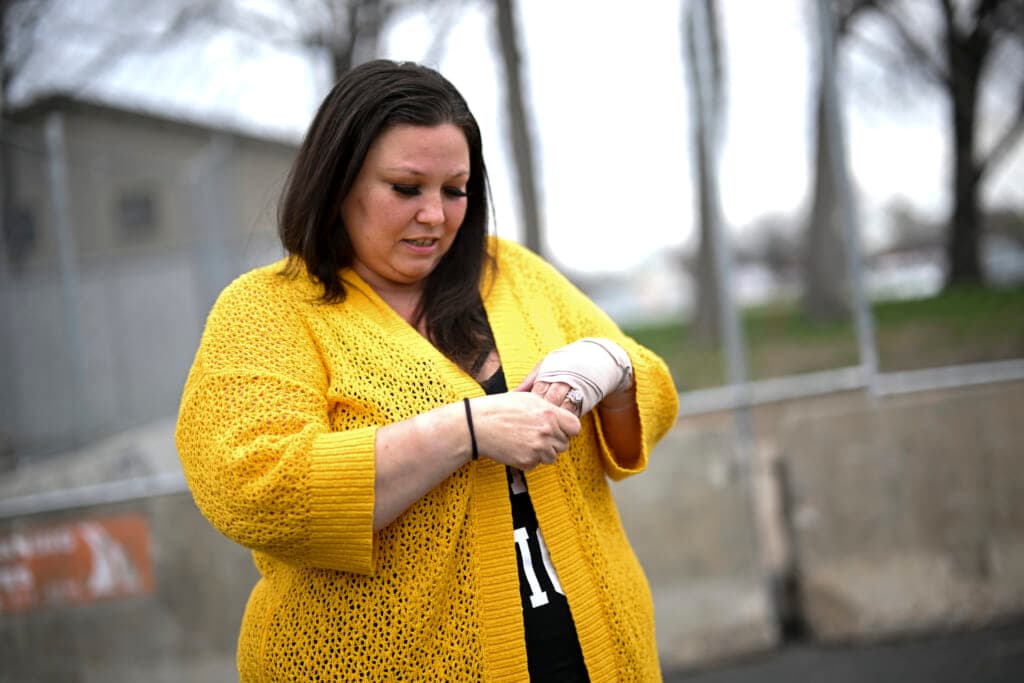 Katie Wright, mother of Daunte Wright, holds the hand on her injured wrist