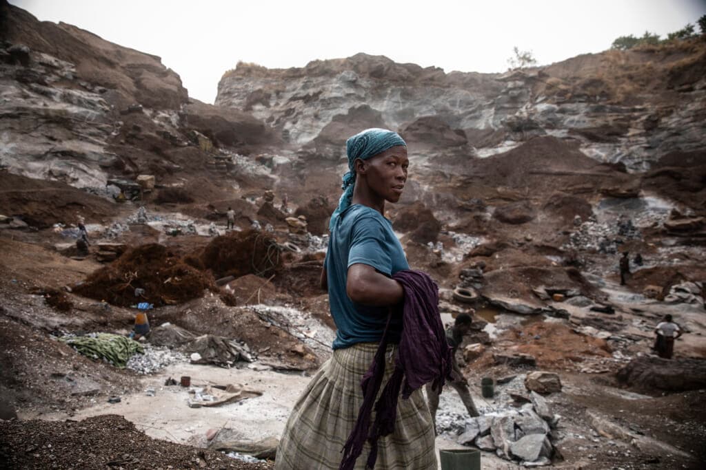 A woman works in a Pissy granite mine