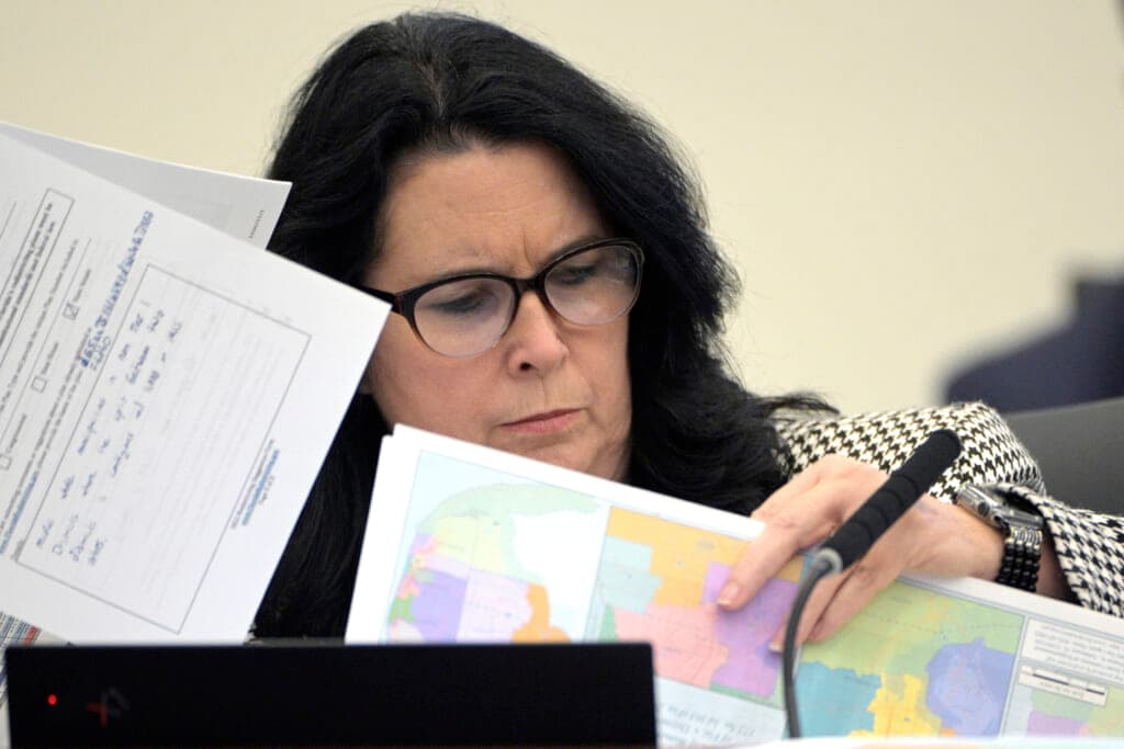 State Senator Kelli Stargel looks through redistricting maps