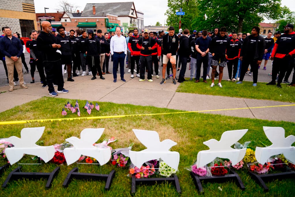 Members of the Buffalo Bills visit the scene of a shooting