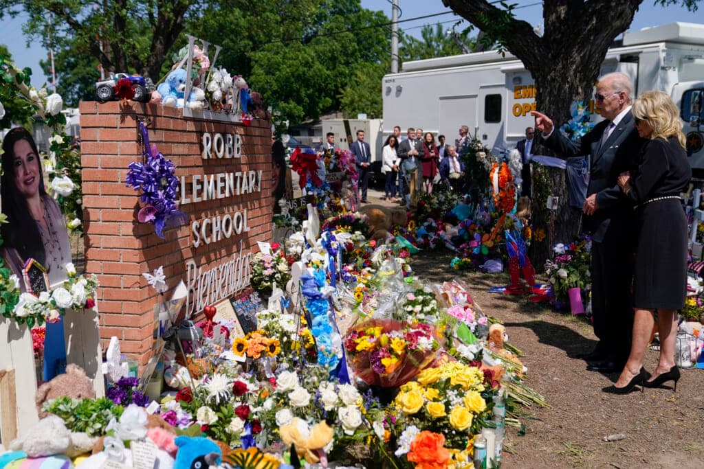 President Joe Biden and first lady Jill Biden view flower memorials left at Robb Elementary School in Uvalde, Texas