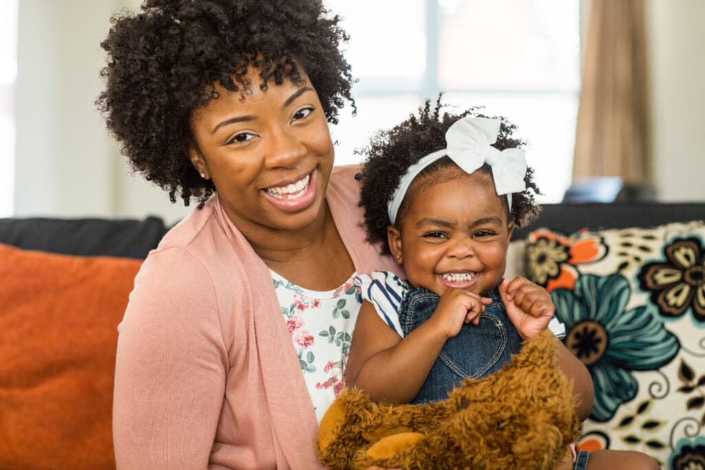 A woman holding a child