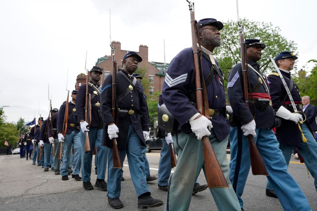 Civil War reenactors march
