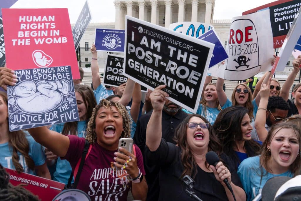 Demonstrators gather outside the Supreme Court