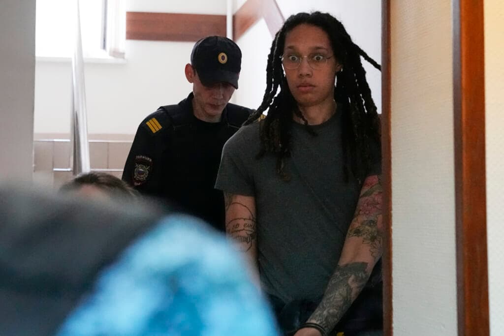 WNBA star and two-time Olympic gold medalist Brittney Griner is escorted to a courtroom