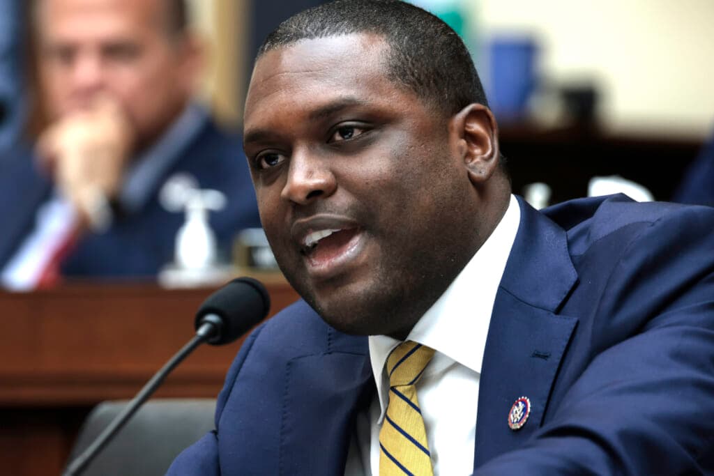 New York Democratic Representative Mondaire Jones wearing a blue jacket and yellow striped tie